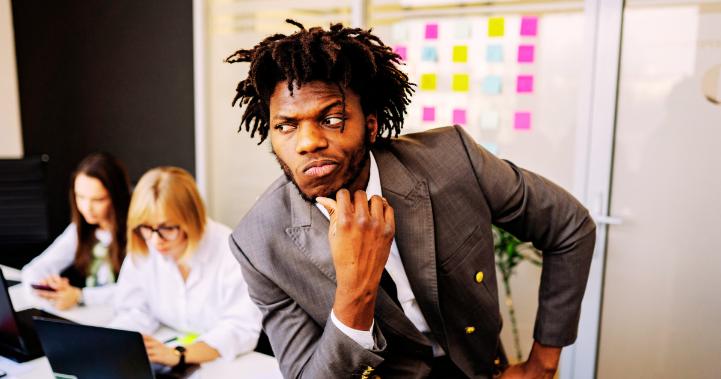 Confused businessman reacting to a difficult business decision.
