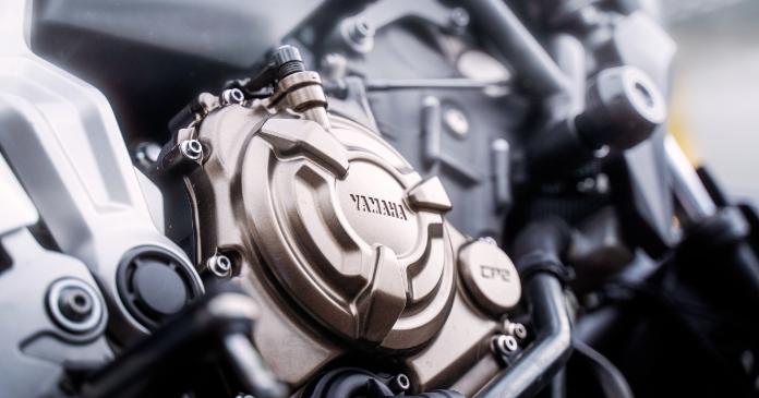 Iconic motorcycle engine with detailed mechanical components and exhaust system